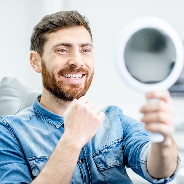 man smiling in mirror