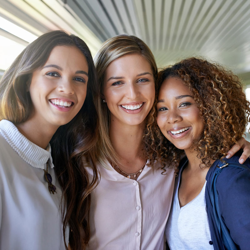 three ladies smiling